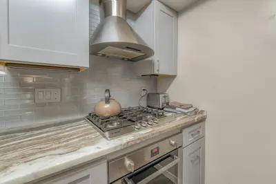 a kitchen with a stove with a pot on it at Bavarian Village Escape For 6 in South Lake Tahoe