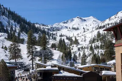 a ski resort with a snow covered mountain at 3BR Condo in Village at Palisades - Premier in Olympic Valley