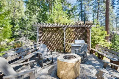 a patio with two chairs and a table and a grill at Peaceful Escape in the Pines Arnold Cabin with Deck in Arnold