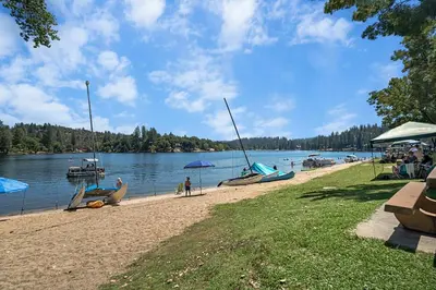 a group of boats on the shore of a lake at Peaceful Pines Escape Near Yosemite, Lake & Golf in Groveland