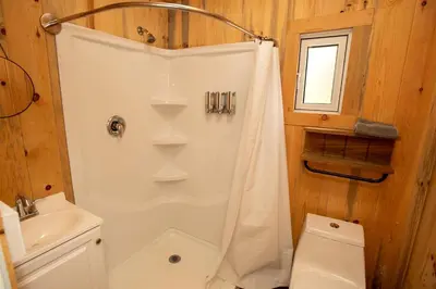 a bathroom with a shower and a toilet at Cozy Modern Tiny Retreat with Stargazing & Yoga Dome Access Near Yosemite Tioga Pass, Groveland, California in Groveland