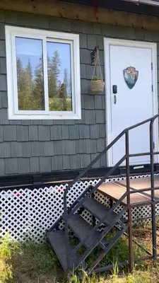 a front door of a house with a bench in front at Cozy Modern Tiny Retreat with Stargazing & Yoga Dome Access Near Yosemite Tioga Pass, Groveland, California in Groveland