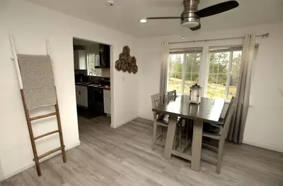 a kitchen and dining room with a table and chairs at Cozy Nature-Filled Home with Garden & Night Sky Views Near Yosemite Tioga Pass, Groveland CA in Groveland