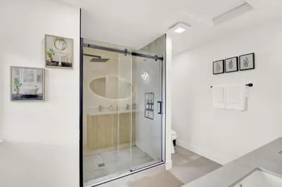 a glass shower in a bathroom with a toilet at Twilight Villa,Hot Tub,EV Charger,Yosemite and Bass lake in Oakhurst