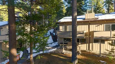 an aerial view of a house with trees at Pinecone Peak by AvantStay Incline Village Condo Fireplace Balconies Pool Access in Incline Village