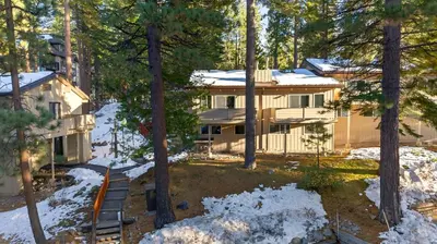 an aerial view of a house in the woods at Pinecone Peak by AvantStay Incline Village Condo Fireplace Balconies Pool Access in Incline Village