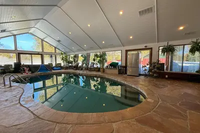 a large indoor swimming pool in a house at Lazy Bear Manor in South Lake Tahoe