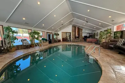 an indoor swimming pool in a house at Lazy Bear Manor in South Lake Tahoe