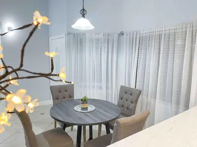 a dining room with a table and chairs in a room at Cozy 2 bedroom 2 baths home in North Highlands