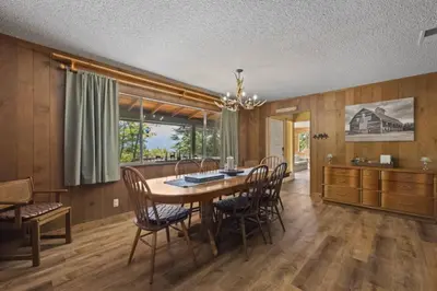 a dining room with a table and chairs at Mountain View House in Mi-Wuk Village