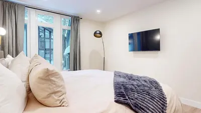 a bedroom with a bed with pillows and a tv at St, Moritz 34 Cozy Centrally Located Condo With Great Complex Amenities condo in Mammoth Lakes