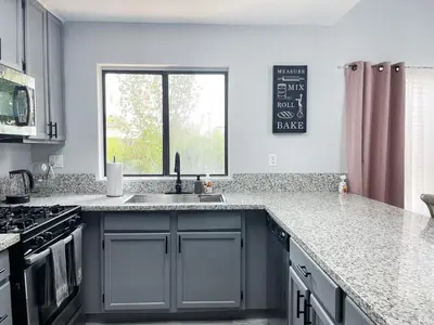 a kitchen with a sink and a window at Beautiful 2 bedroom 2 bathroom house in North Highlands