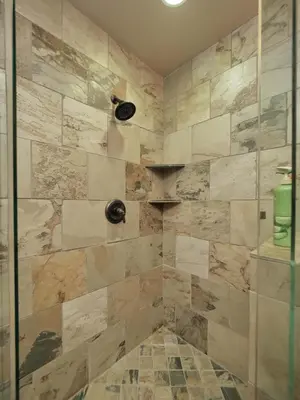 a bathroom with a shower with a stone wall at Kirkwood Mountainside Cabin Views Walk to Lifts in Kirkwood