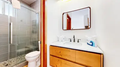 a bathroom with a toilet and a sink and a shower at Snowcreek V #777 condo in Mammoth Lakes