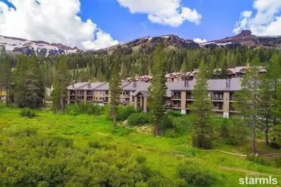 an aerial view of a resort in the mountains at The Meadows-Cozy Hotel Room Deck in Kirkwood