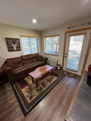 a living room with a couch and a coffee table at The Meadows-Cozy Hotel Room Deck in Kirkwood