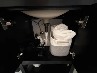 a white towel is sitting under a sink at The Meadows- Charming 1BD2BA Ski Condo in Kirkwood