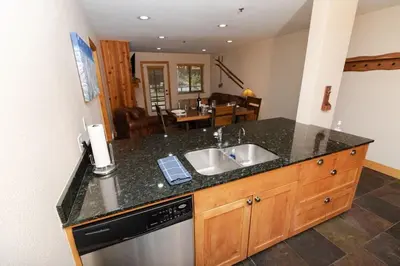 a kitchen with a sink and a counter top at The Meadows - 2 Bdrm Family Condo in Kirkwood in Kirkwood
