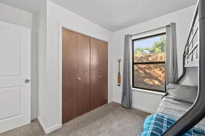 a bedroom with a bed and a window at Game Room, 8 guests- Lake, Yosemite, Sonora nearby in Groveland