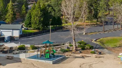an aerial view of a park with a playground at Game Room, 8 guests- Lake, Yosemite, Sonora nearby in Groveland