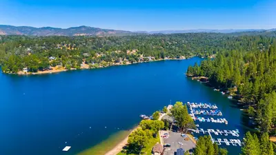 an aerial view of a lake with boats docked at Game Room, 8 guests- Lake, Yosemite, Sonora nearby in Groveland