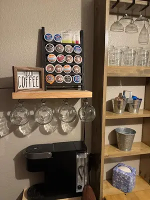 a shelf with cups and a coffee machine in a kitchen at Kirkwood Studio SKI IN Walk out in Kirkwood