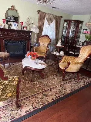 a living room with chairs and a table and a fireplace at Tranquil 1BR Haven Peaceful Stay in Prime Clovis in Clovis