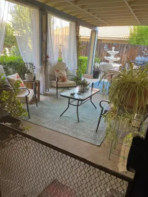 a patio with a table and chairs and plants at Tranquil 1BR Haven Peaceful Stay in Prime Clovis in Clovis