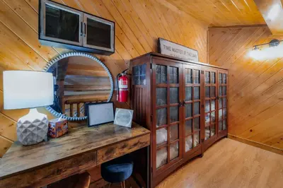 a room with a desk with a mirror and a television at Tramway Loft Cozy Stay for 4 in Stateline