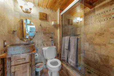 a bathroom with a toilet and a sink and a shower at Tramway Loft Cozy Stay for 4 in Stateline