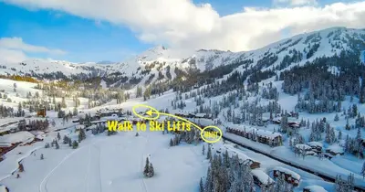 a snowy mountain with a sign that says way of the light at Ski in or Walk to lifts hot tub covered parking in Kirkwood