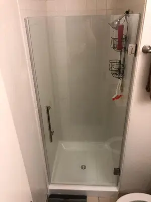 a shower with a glass door in a bathroom at Ski in out King bed Suite Mountain View in Kirkwood