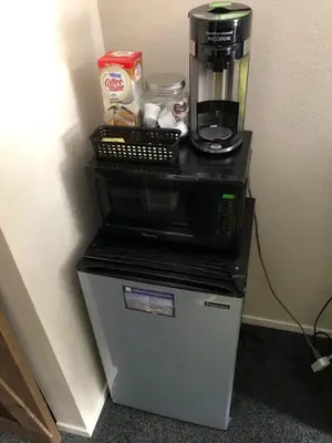 a coffee maker sitting on top of a refrigerator at Ski in out King bed Suite Mountain View in Kirkwood