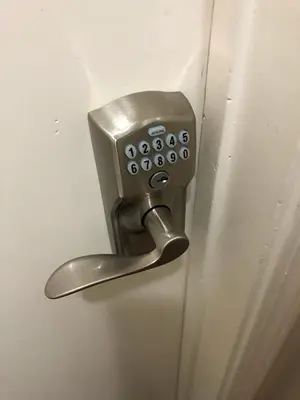 a metal door handle on a white door at Ski in Ski out King Bed Suite Hotel Room Near Village in Kirkwood