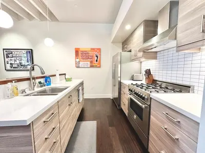 a kitchen with a sink and a stove at Modern 2 Bedroom by Midtown Walk Distance to Bars and Restaurants in Sacramento