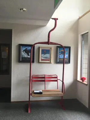 a red metal rack in the corner of a room at Sun Meadows Cozy Kirkwood Ski In out Studio in Kirkwood