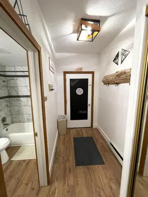 a bathroom with a tub and a toilet and a sink at Sun Meadows Cozy Kirkwood Ski In out Studio in Kirkwood