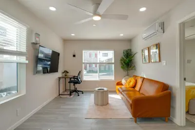 a living room with a couch and a tv at Great for Digital Nomads! Convenient Manteca Apt in Manteca