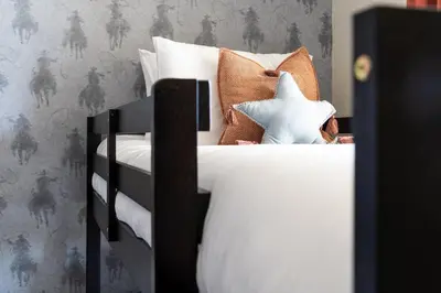 a black and white bed with a star on it at Dusty Sage Hollow in Fernley