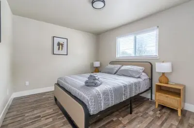 a bedroom with a bed and a window at Pet-Friendly Home - Big Yard for Family Stays in Sacramento