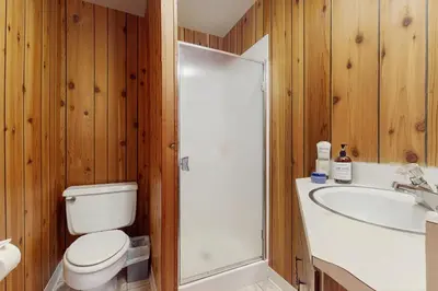 a bathroom with a shower and a toilet and a sink at Alpenglow at Dollar Point in Dollar Point