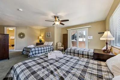 a bedroom with two beds and a ceiling fan at 2253 Catalina Drive home in South Lake Tahoe
