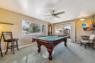 a pool table in a room with a ceiling fan at 2253 Catalina Drive home in South Lake Tahoe