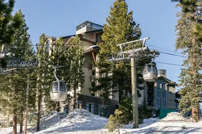 a ski lift in front of a building at Mammoth Monache Resort in Mammoth Lakes