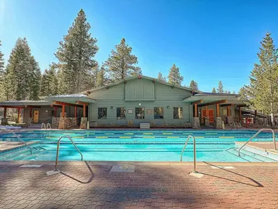 a large swimming pool in front of a building at Family cabin on resort at Northstar in Truckee