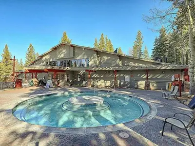 a large building with a fountain in front of it at Family cabin on resort at Northstar in Truckee