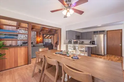 a kitchen and living room with a dining table and a ceiling fan at Dollar Point - Observation Dr, home in Tahoe City
