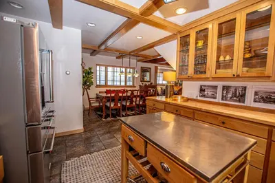 a kitchen with a refrigerator and a dining room at Nightingale's Nest in Carnelian Bay