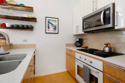 a kitchen with a stove top oven next to a sink at Alpine Meadows Basecamp in Alpine Meadows