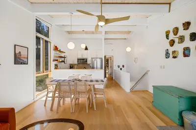a kitchen and dining room with a table and chairs at Alpine Meadows Basecamp in Alpine Meadows